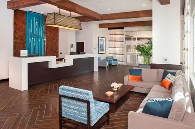 a living room with a couch and a table at Hilton Garden Inn Burbank Los Angeles in Burbank