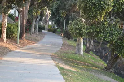 a walking path in a park with trees at Seaside Inn Motel in Port Hueneme