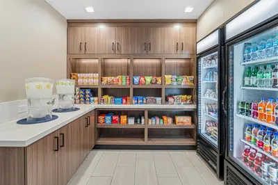 a store refrigerator with food and drinks in it at Best Western Valencia/Six Flags Inn & Suites in Santa Clarita