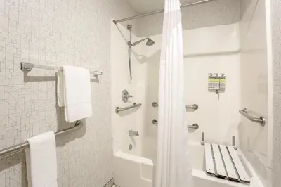 a white bathroom with a shower and a toilet at Holiday Inn Express Lancaster by IHG in Lancaster