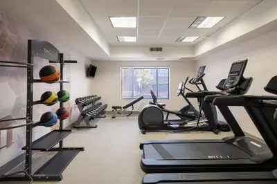 a fitness room with treadmills and cardio machines at SpringHill Suites Pasadena Arcadia in Arcadia