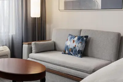 a living room with a couch and a table at Courtyard by Marriott Ontario Rancho Cucamonga in Rancho Cucamonga