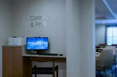 a computer sitting on a desk in a room at Fairfield Inn and Suites San Bernardino in San Bernardino