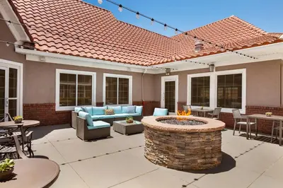 a patio with a fire pit in the middle at Residence Inn by Marriott Palmdale Lancaster in Palmdale