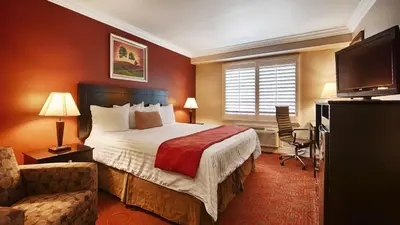 a hotel room with a bed and a television at Best Western Burbank Airport Inn in Los Angeles