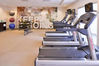 a gym with treadmills and cardio machines at SpringHill Suites by Marriott Corona Riverside in Corona