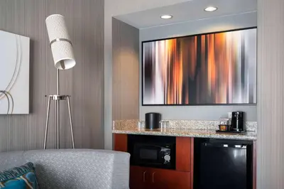 a living room with a tv on a wall at Sonesta Select Camarillo in Camarillo
