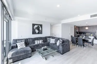 a living room with a couch and a table at Top Floor 3 Bed 3 Bath Penthouse Living In Luxury in Los Angeles