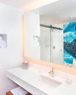 a bathroom with a sink and a mirror at Courtyard by Marriott Santa Monica in Los Angeles