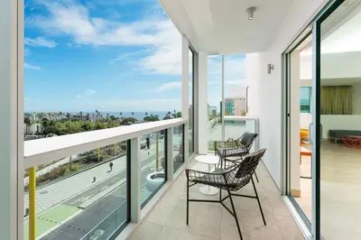 a balcony with chairs and a view of the city at Courtyard by Marriott Santa Monica in Los Angeles