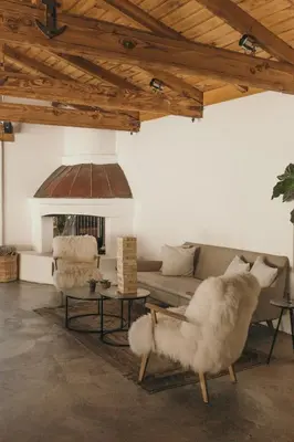 a living room with a couch and a fireplace at CALAMIGOS RANCH Resort & Spa in Malibu
