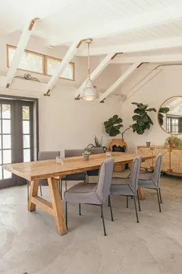 a dining room with a wooden table and chairs at CALAMIGOS RANCH Resort & Spa in Malibu