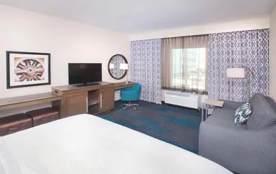a hotel room with a bed and a desk at Hampton Inn & Suites LAX El Segundo in El Segundo