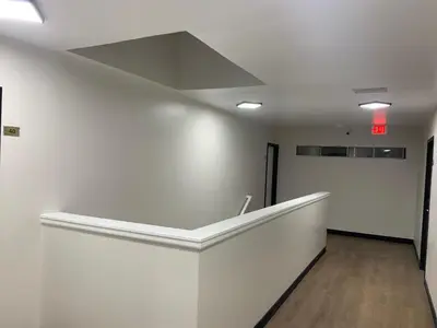 an empty room with a white wall and a ceiling at Encore Inn Inglewood in Inglewood