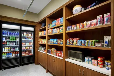 a room with shelves filled with food and drinks at Hampton Inn & Suites Santa Monica in Los Angeles