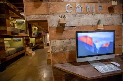 a computer monitor sitting on a table in a store at PodShare East Hollywood in Los Angeles