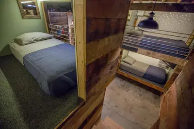 a bedroom with two bunk beds in a room at PodShare East Hollywood in Los Angeles