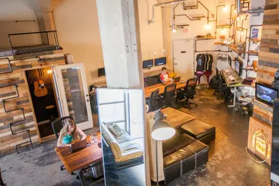 a room with a woman sitting at a table in a store at PodShare Hollywood in Los Angeles