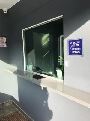 a window in a building with a sign on it at Empire Inn in Los Angeles