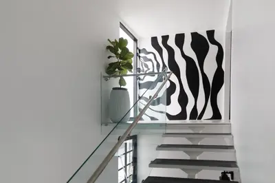 a staircase with a potted plant on the wall at Park Plaza Lodge in Los Angeles