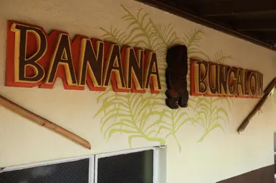 a sign on the side of a building with the name of a restaurant at Banana Bungalow Hollywood Hotel & Hostel in Los Angeles