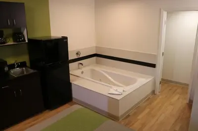 a large bath tub in a room with a sink at Studio 6 Victorville - Apple Valley in Victorville