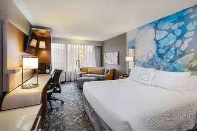 a hotel room with a bed and a desk at Courtyard by Marriott Riverside UCR/Moreno Valley Area in Riverside