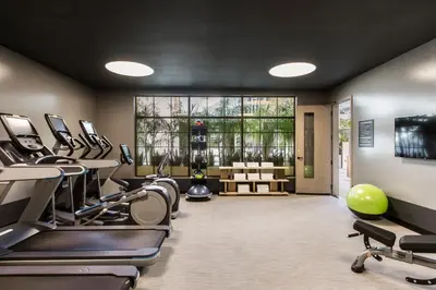 a gym with treadmills and elliptical machines at Kimpton La Peer Hotel West Hollywood by IHG in Los Angeles