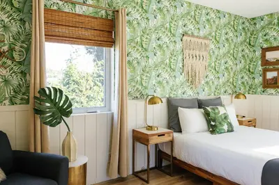 a bedroom with a bed and a window at Noon on Sunset Hill in Los Angeles