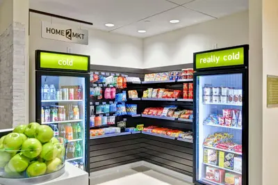 a store with two refrigerators in a grocery store at Home2 Suites Azusa in Azusa