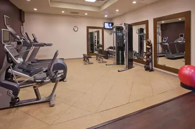 a gym with treadmills and machines in a room at DoubleTree by Hilton Rosemead in Rosemead