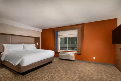 a hotel room with a bed and a window at Holiday Inn Express & Suites Chatsworth by IHG in Chatsworth