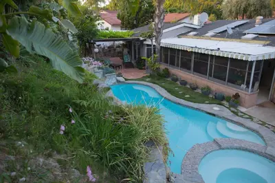 an aerial view of a house with a swimming pool at Artistic Resort Like Home with Pool in Fullerton