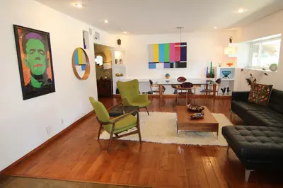 a living room with a couch and a table at Artistic Resort Like Home with Pool in Fullerton