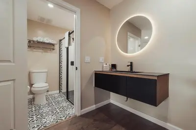 a bathroom with a sink and a toilet and a mirror at The Dixie Hollywood in Los Angeles