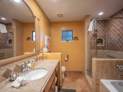a bathroom with a sink and a shower and a toilet at Su Nido Inn in Ojai