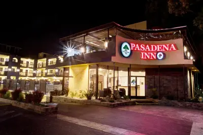 a hotel with a sign that reads pasadena inn at GreenTree Pasadena in Pasadena