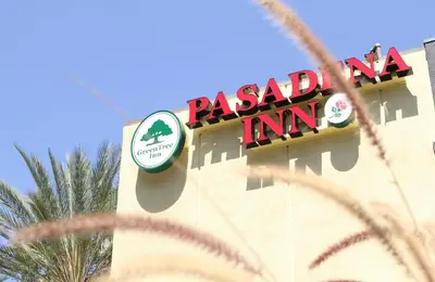 aoked inn sign on the side of a building at GreenTree Pasadena in Pasadena