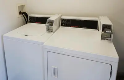 two appliances sitting on top of a washer and dryer at GreenTree Pasadena in Pasadena