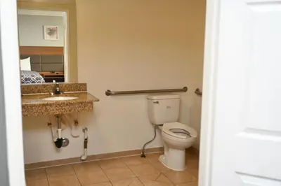 a bathroom with a toilet and a sink at Hollywood Stars Inn in Los Angeles