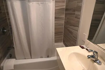 a bathroom with a shower and a sink and a toilet at Hollywood Stars Inn in Los Angeles
