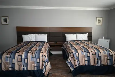 a hotel room with two beds in a room at Hollywood Stars Inn in Los Angeles