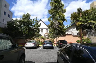 a group of cars parked in a parking lot at Hollywood Stars Inn in Los Angeles