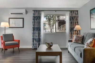 a living room with a couch and a chair at Club Wyndham Dolphin's Cove in Anaheim