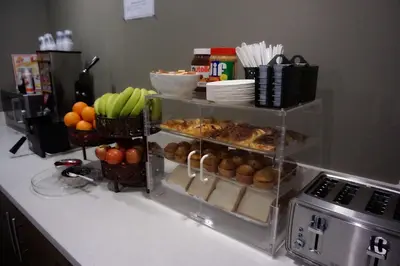 a kitchen counter with a bunch of fruits and vegetables at Hartford Hotel Best Western Signature Collection in Rosemead