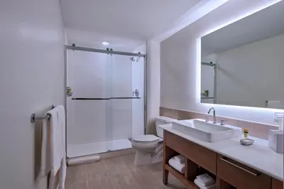 a bathroom with a shower and a sink and a toilet at Element Palmdale in Palmdale