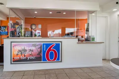 a sign for a store with the on it at Motel 6-San Bernardino, CA - Downtown in San Bernardino