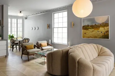 a living room with a couch and a table at Palihotel Westwood Village - West Beverly Hills in Los Angeles
