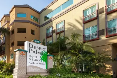 a hotel sign in front of a building at Desert Palms Hotel & Suites Anaheim Resort in Anaheim