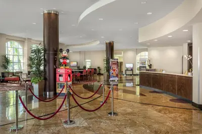 a lobby with a christmas ornament on the floor at Desert Palms Hotel & Suites Anaheim Resort in Anaheim